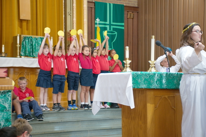 Our wonderful students holding up beads during the Living Rosary