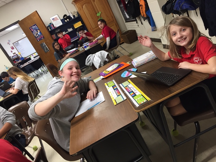Pictures of 5th Grade working on Stock Market Games. 